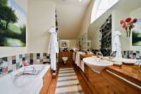 Delightful bathroom with separate shower.