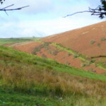 Scenic view of rolling hills near Dick Turpin Cottage in the countryside.